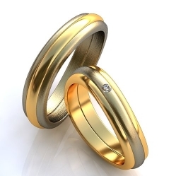 Изогнутые обручальные кольца с бриллиантом